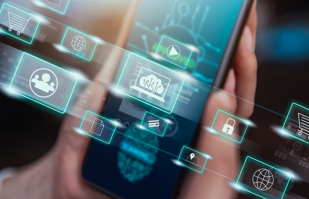 Technology concept with hand holding smartphone