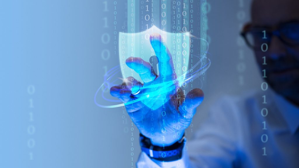 Man touching padlock and shield icon